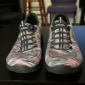 Never worn, but gently loved by my cat (see photos) Skechers size 8 Multi Color